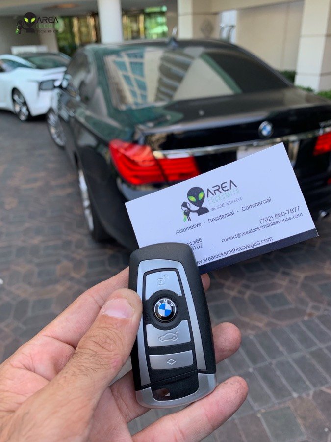 Replacement BMW smart key fob made at a Las Vegas resort, BMW 7 Series in the background